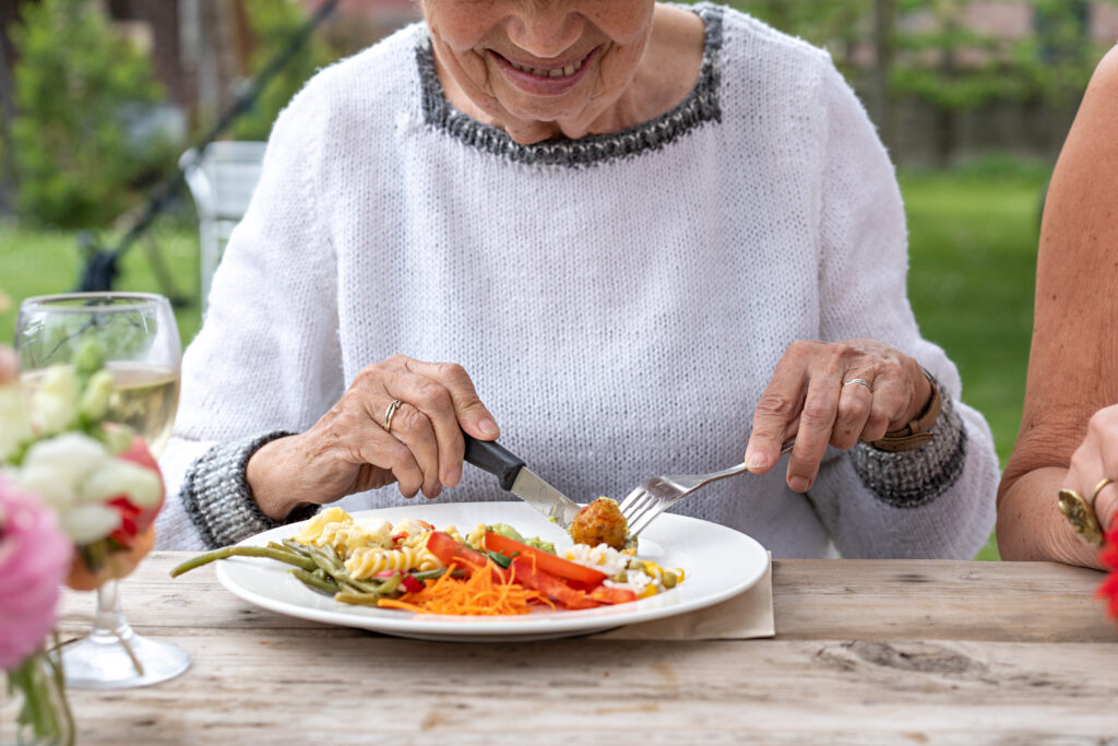 elderly woman s outdoor meal 2025 03 05 11 57 55 utc | Dunham Care Homes