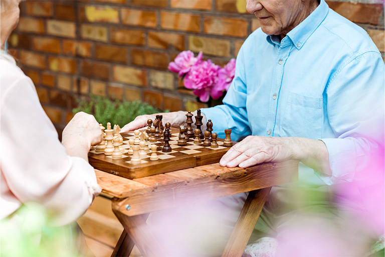 cropped view of retired couple playing chess on wo 2024 11 07 14 59 36 utc | Dunham Care Homes
